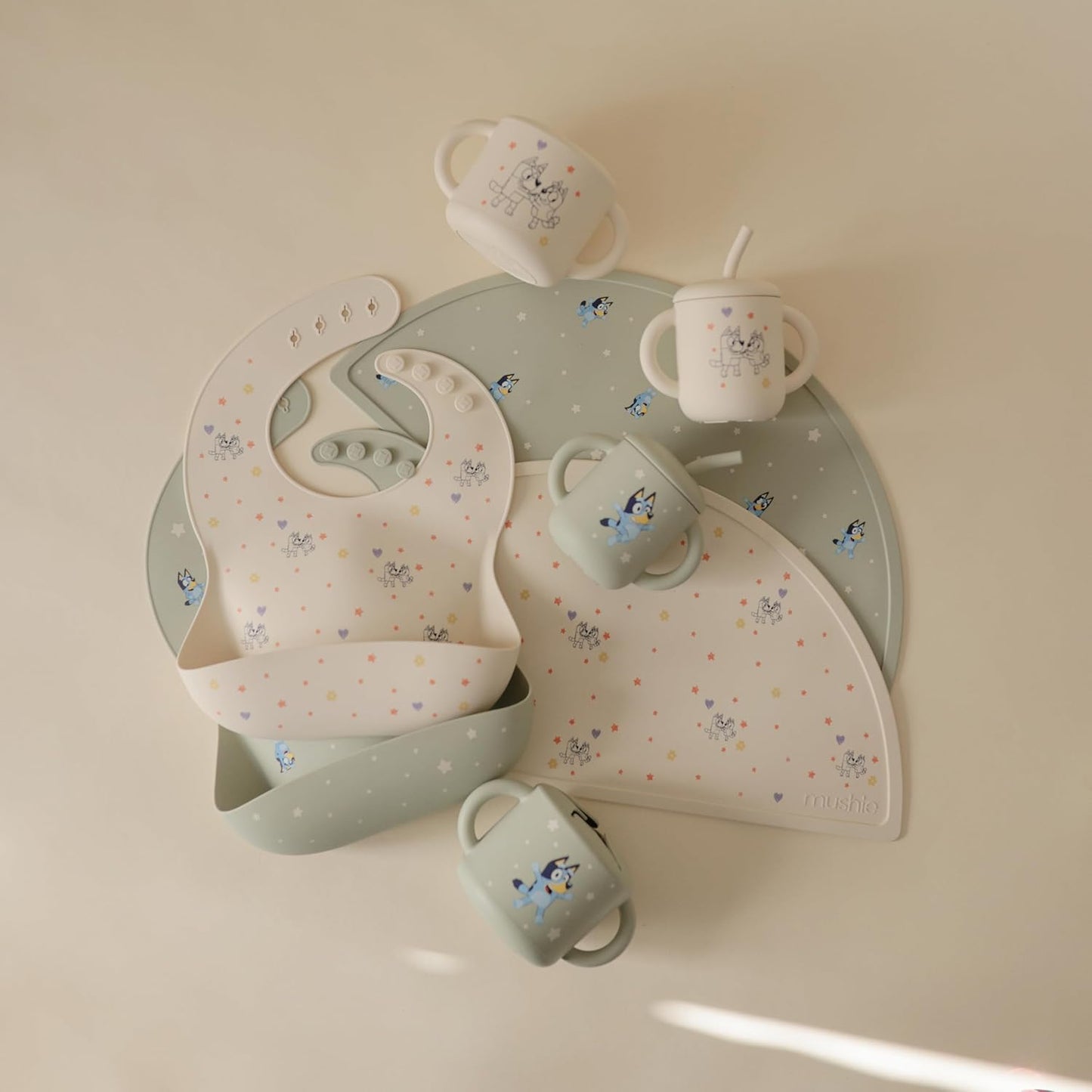 mushie x Bluey Silicone Baby Bib | Adjustable Fit Waterproof Bibs (Bluey Ivory)