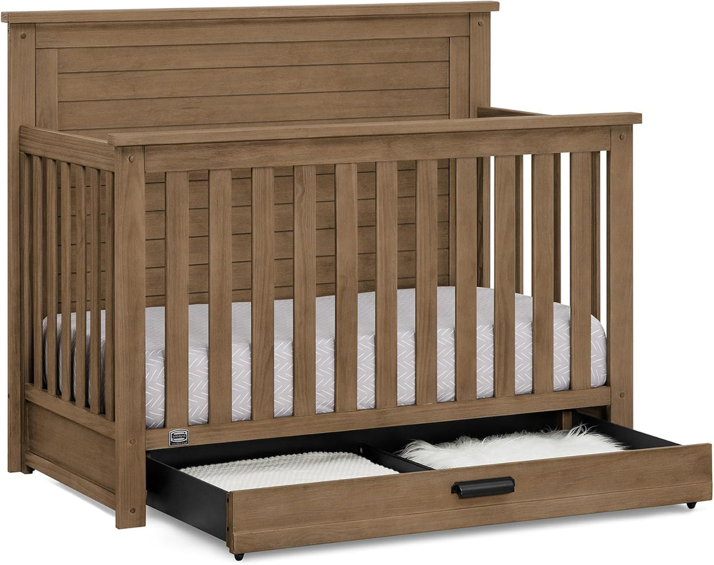 Delta Children Simmons Kids Caden 6-in-1 Convertible Crib with Trundle Drawer, Greenguard Gold Certified, Aged Oak